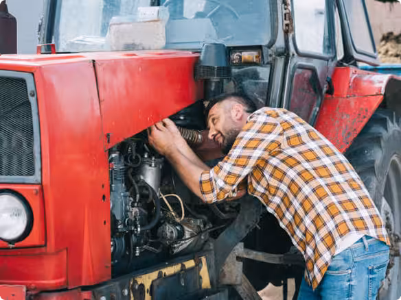 Mechanic working on tractor